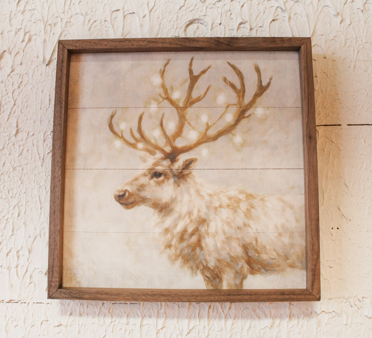 White reindeer for christmas in snowy winter wonderland scene for christmas framed wall art for sale at the rustic barn in Killingworth, CT