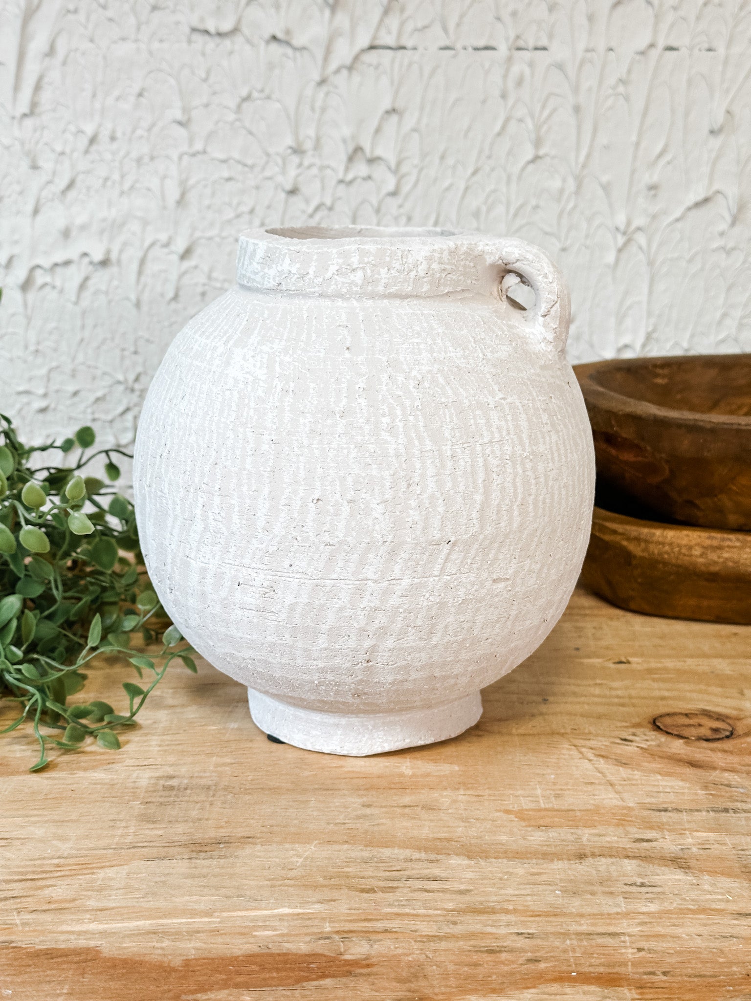 white textured small vase with a small handle at the rustic barn in killingworth ct