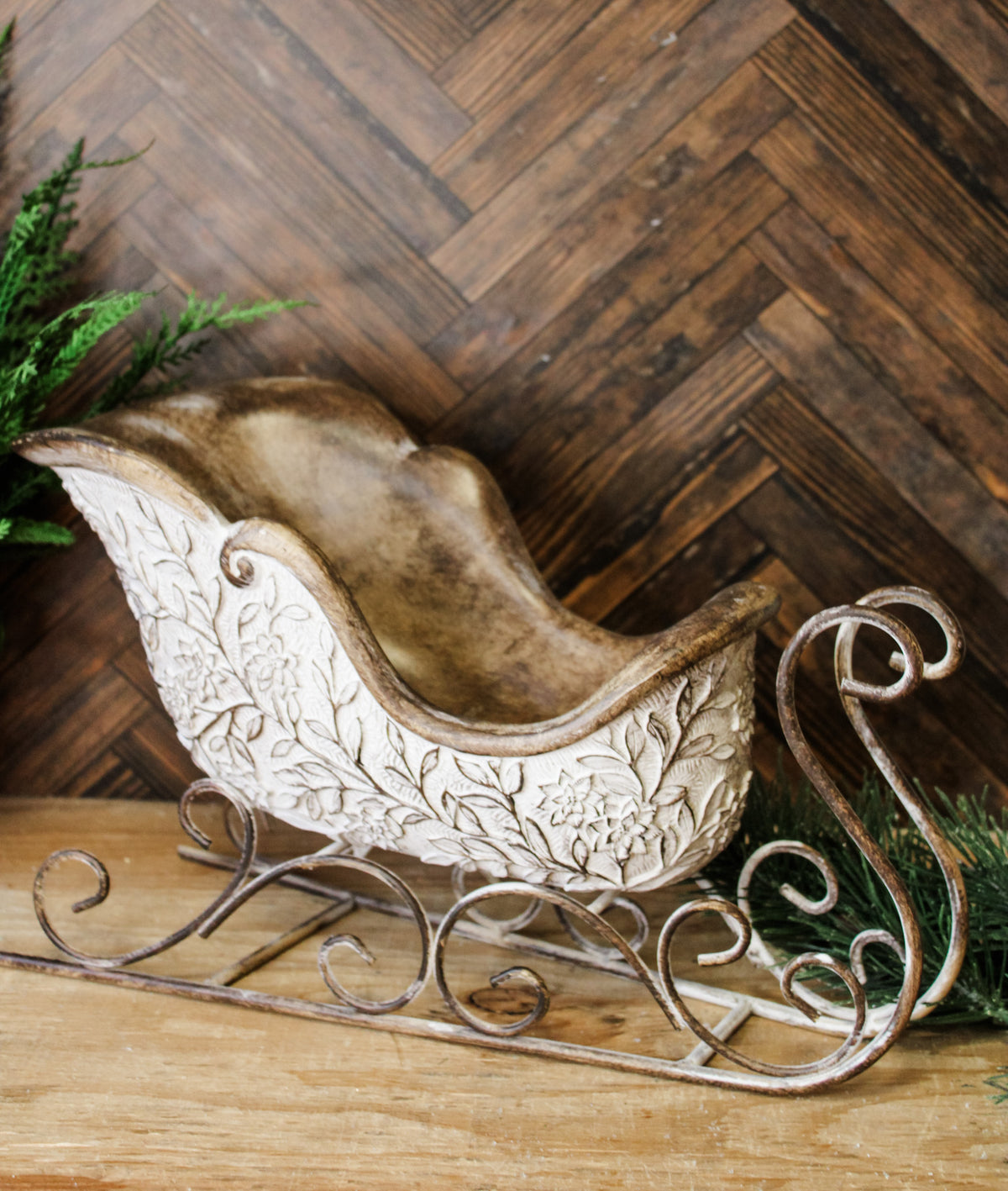 White washed rustic vintage sleigh for the holidays floral arrangement holder for sale at the rustic barn in killingworth, CT