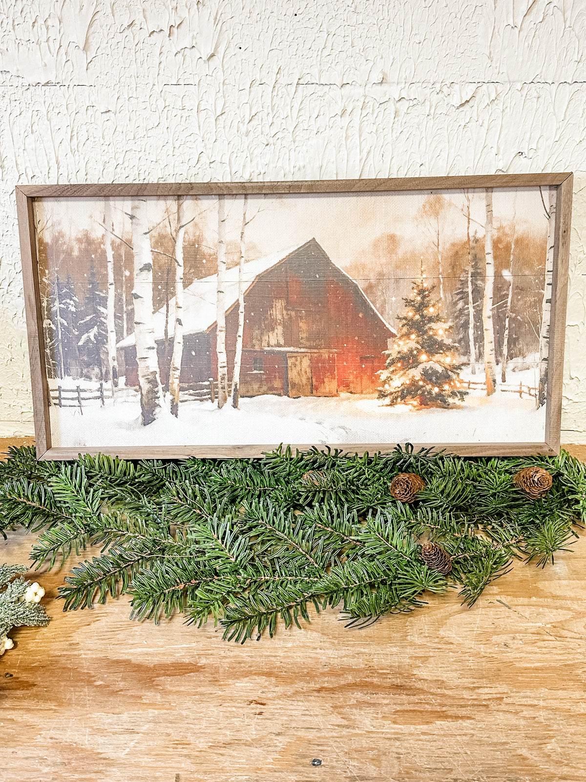 wood framed red barn in snow with christmas tree print at the rustic barn in killingworth ct