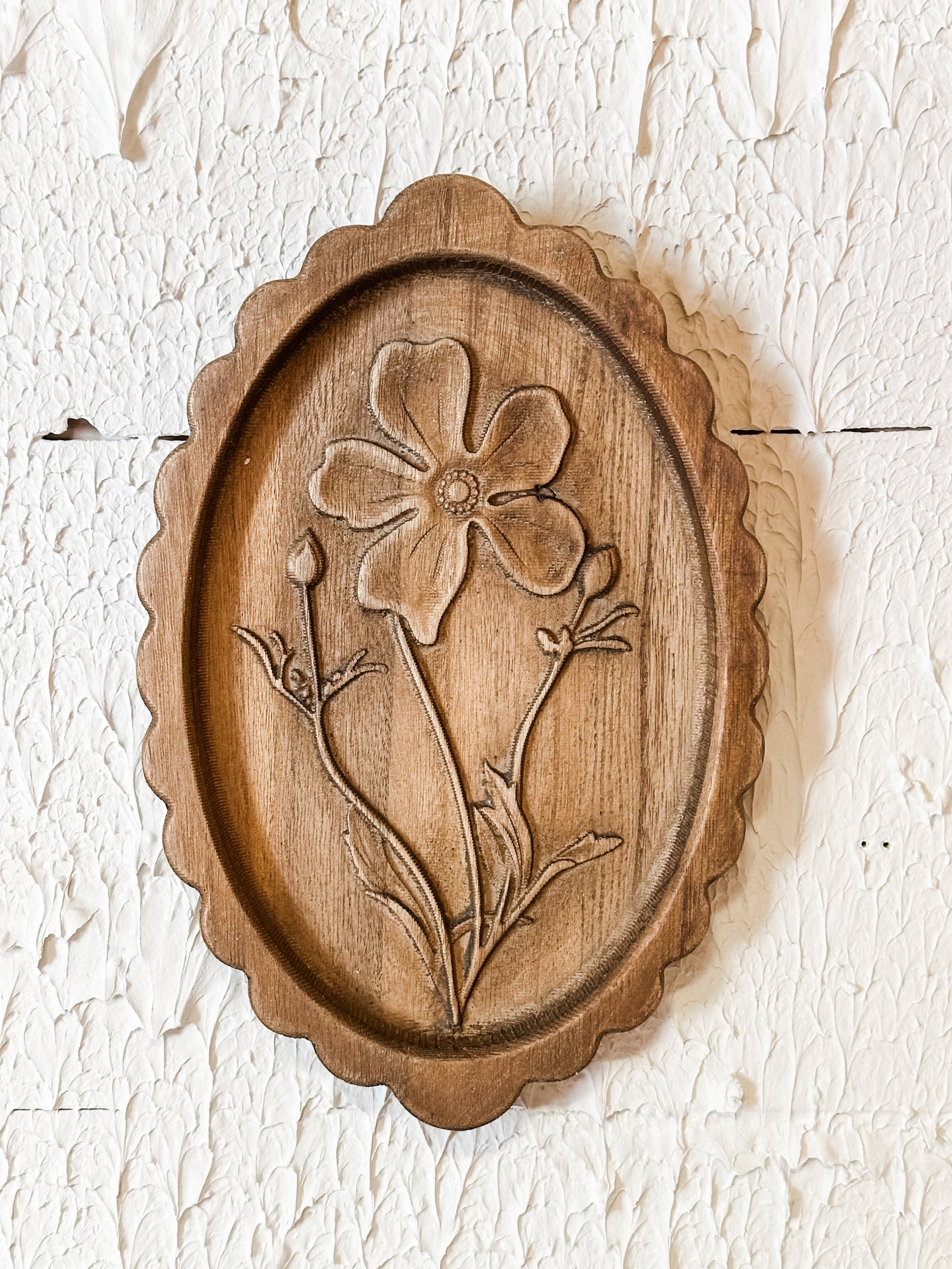 wood scalloped wall decor with laser etched botanicals at the Rustic Barn in Killingworth CT