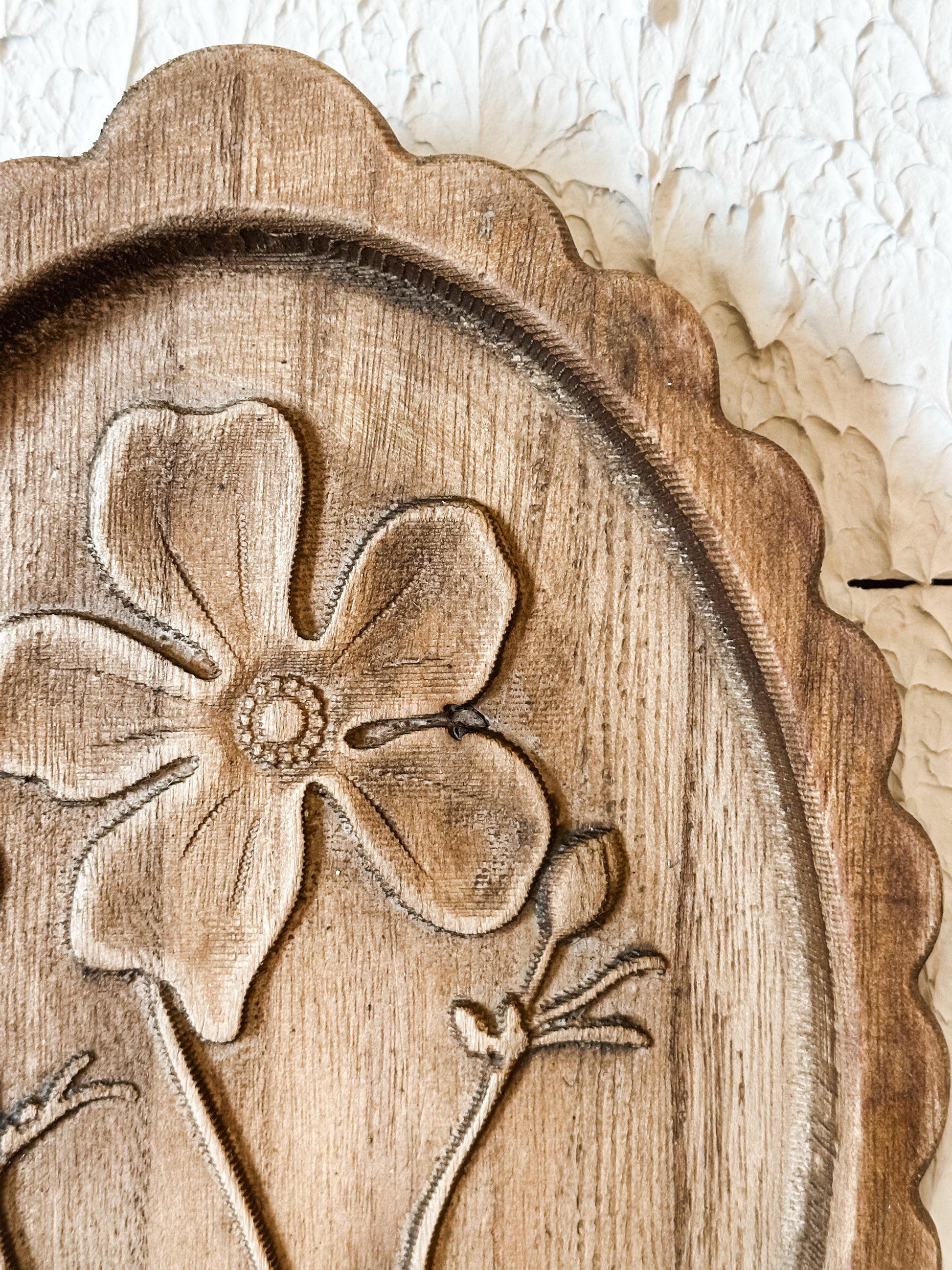 wood scalloped wall decor with laser etched botanicals at the Rustic Barn in Killingworth CT