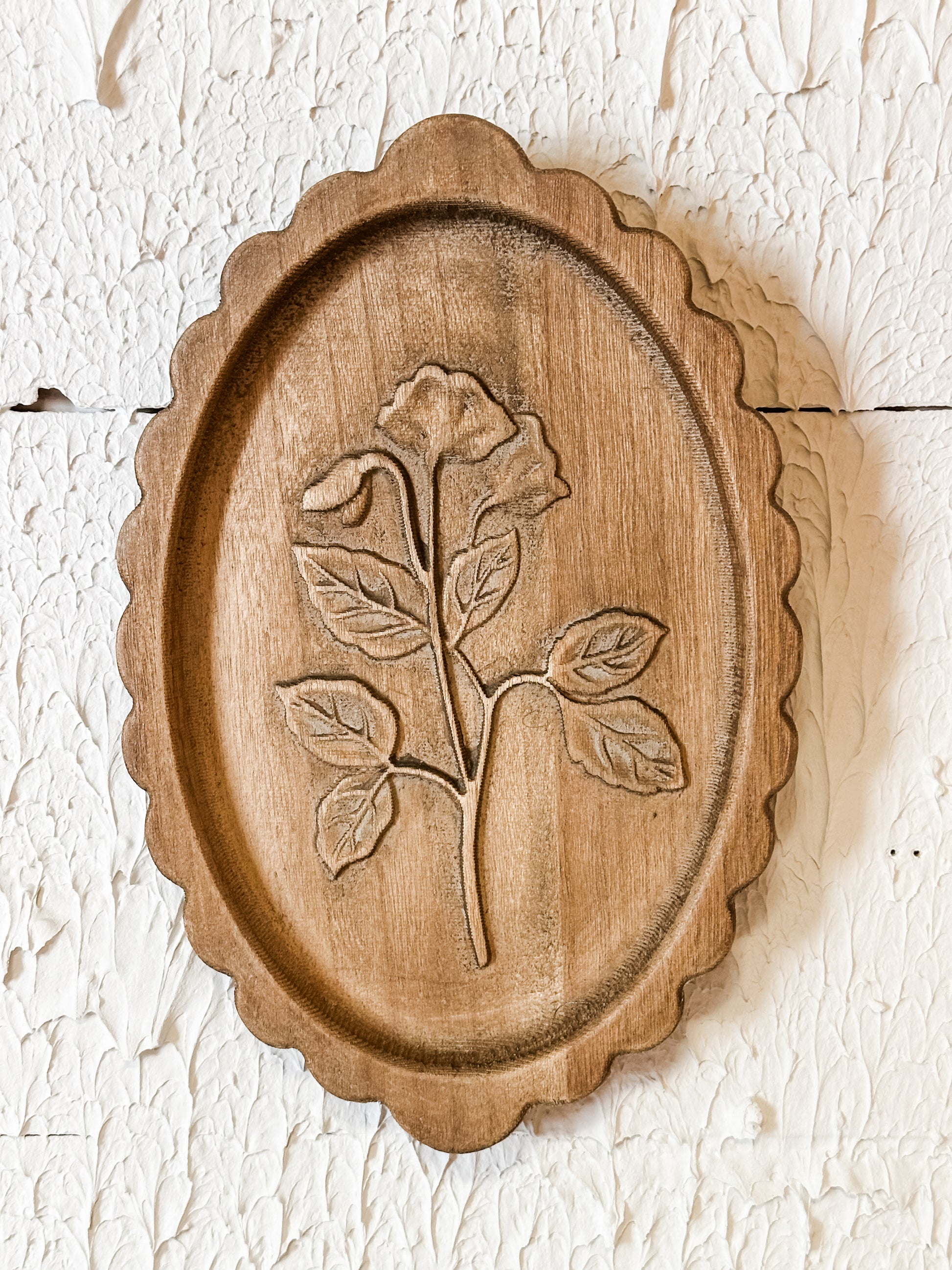 wood scalloped wall decor with laser etched botanicals at the Rustic Barn in Killingworth CT