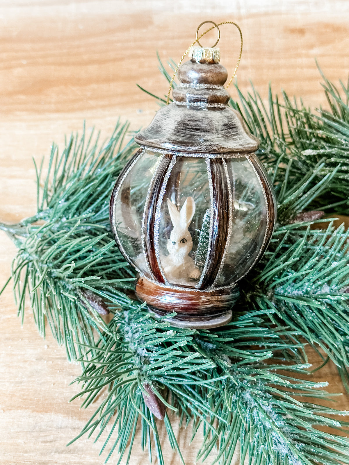 glass lantern ornament with bunny icon in it at the rustic barn in killingworth ct