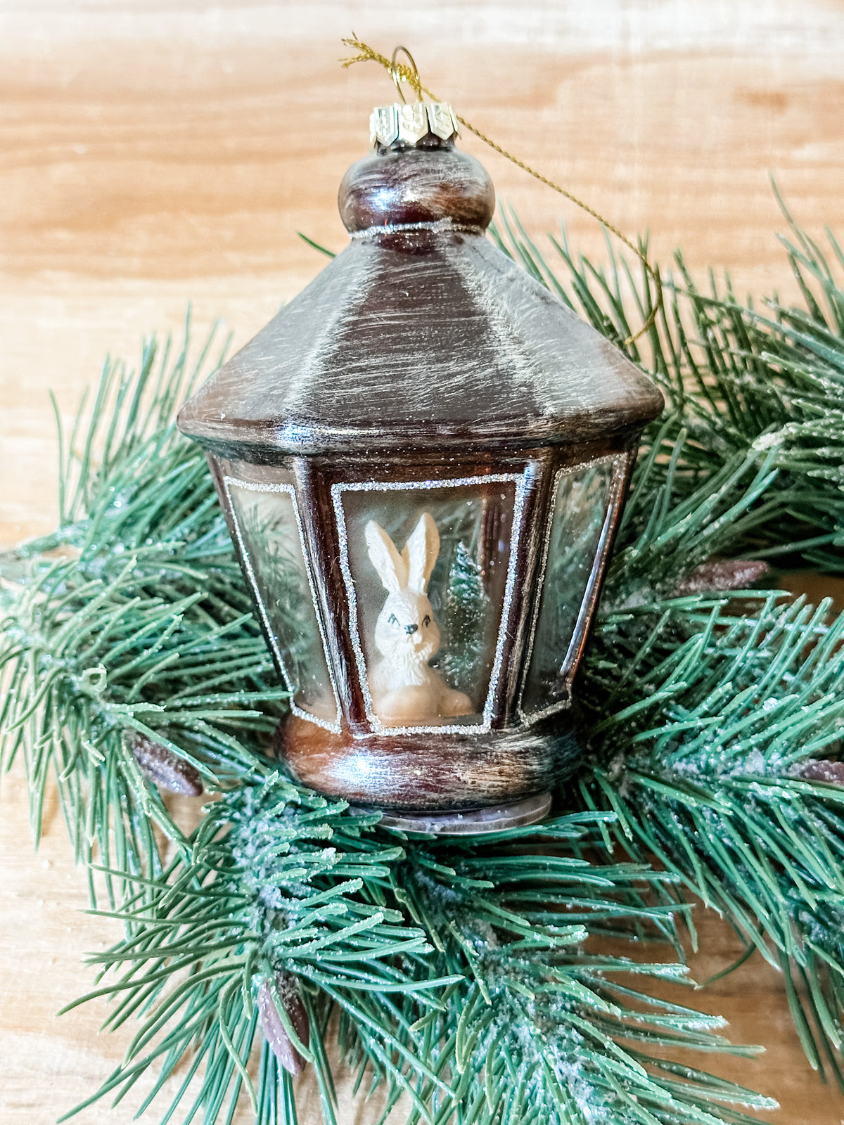glass lantern ornament with bunny icon in it at the rustic barn in killingworth ct