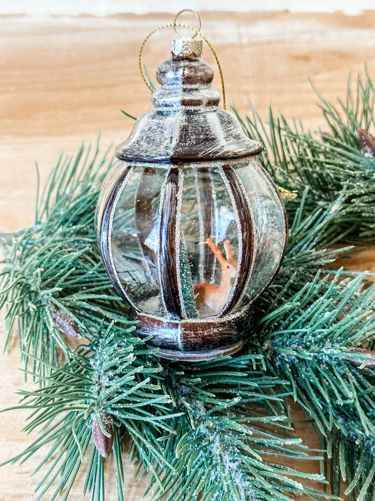 glass lantern ornament with deer icon in it at the rustic barn in killingworth ct