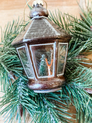 glass lantern ornament with deer icon in it at the rustic barn in killingworth ct