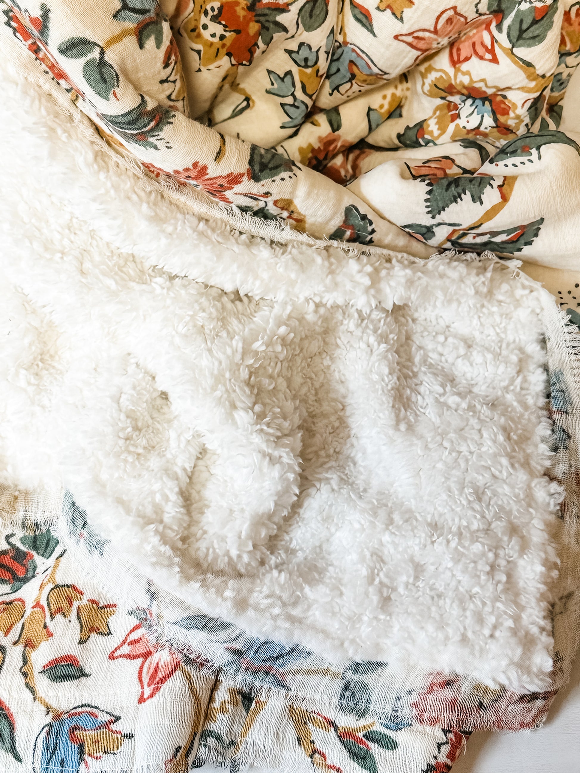 woven cotton throw with sherpa back and flower print with fringe at the Rustic Barn in Killingworth CT