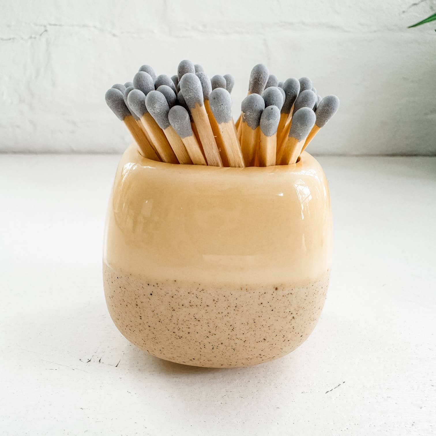 yellow ceramic match holders with matches