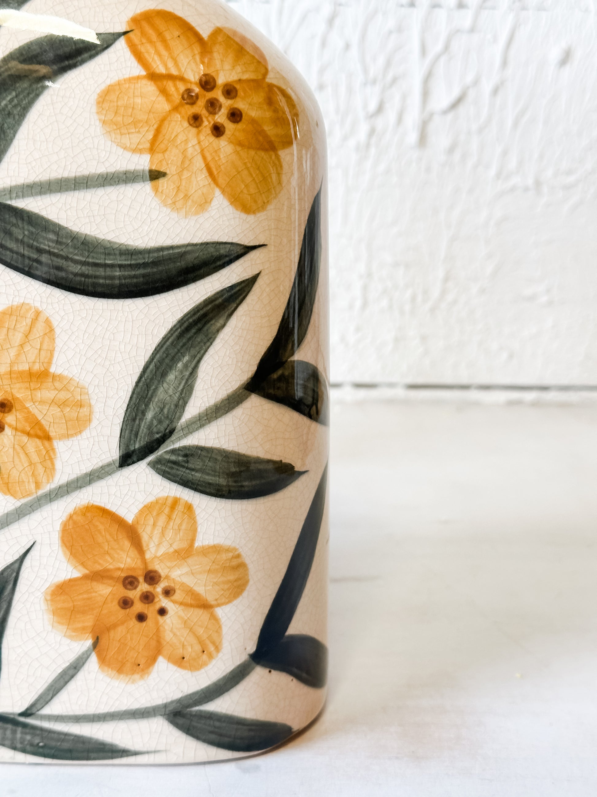 ceramic yellow flat vase with floral design at the Rustic Barn in Killingworth, CT
